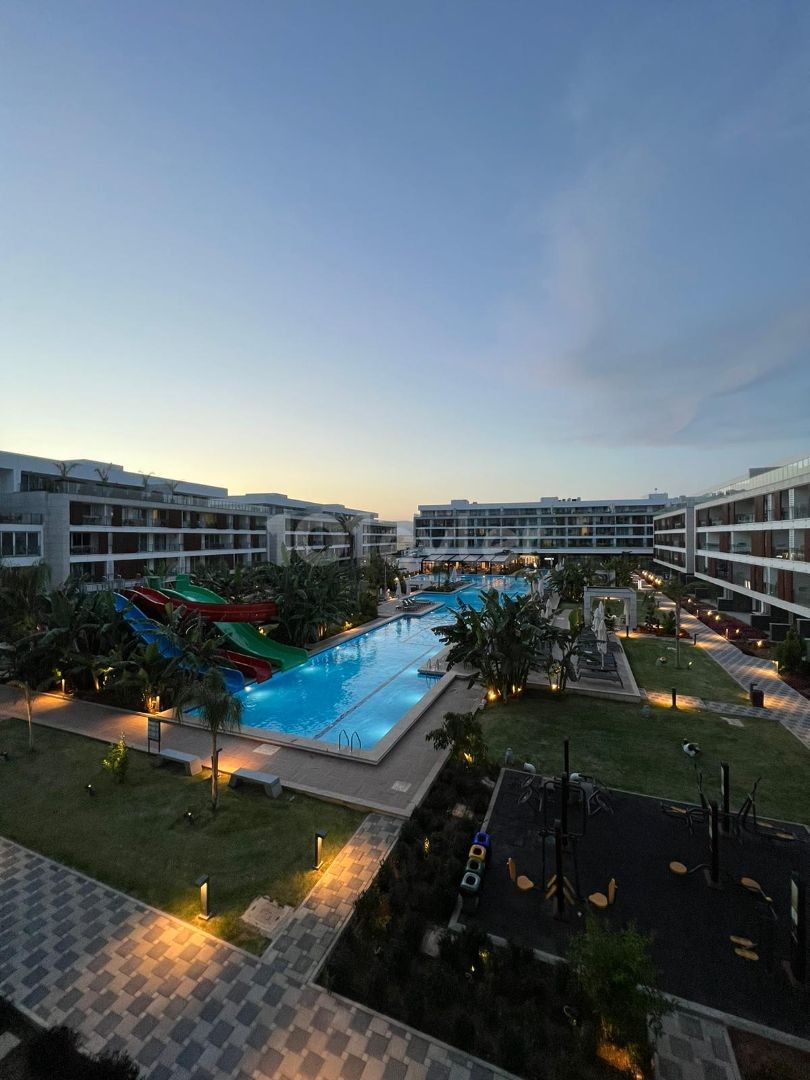 Элитная резиденция с концепцией отеля рядом с морем в районе Iskele Loungbeach на продажу 1+0 Habibe ÇETİN 05338547005